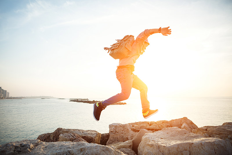 Man Jumping on Rocks