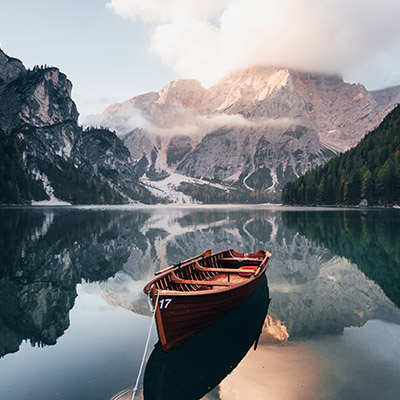 Wooden boat on mountain lake